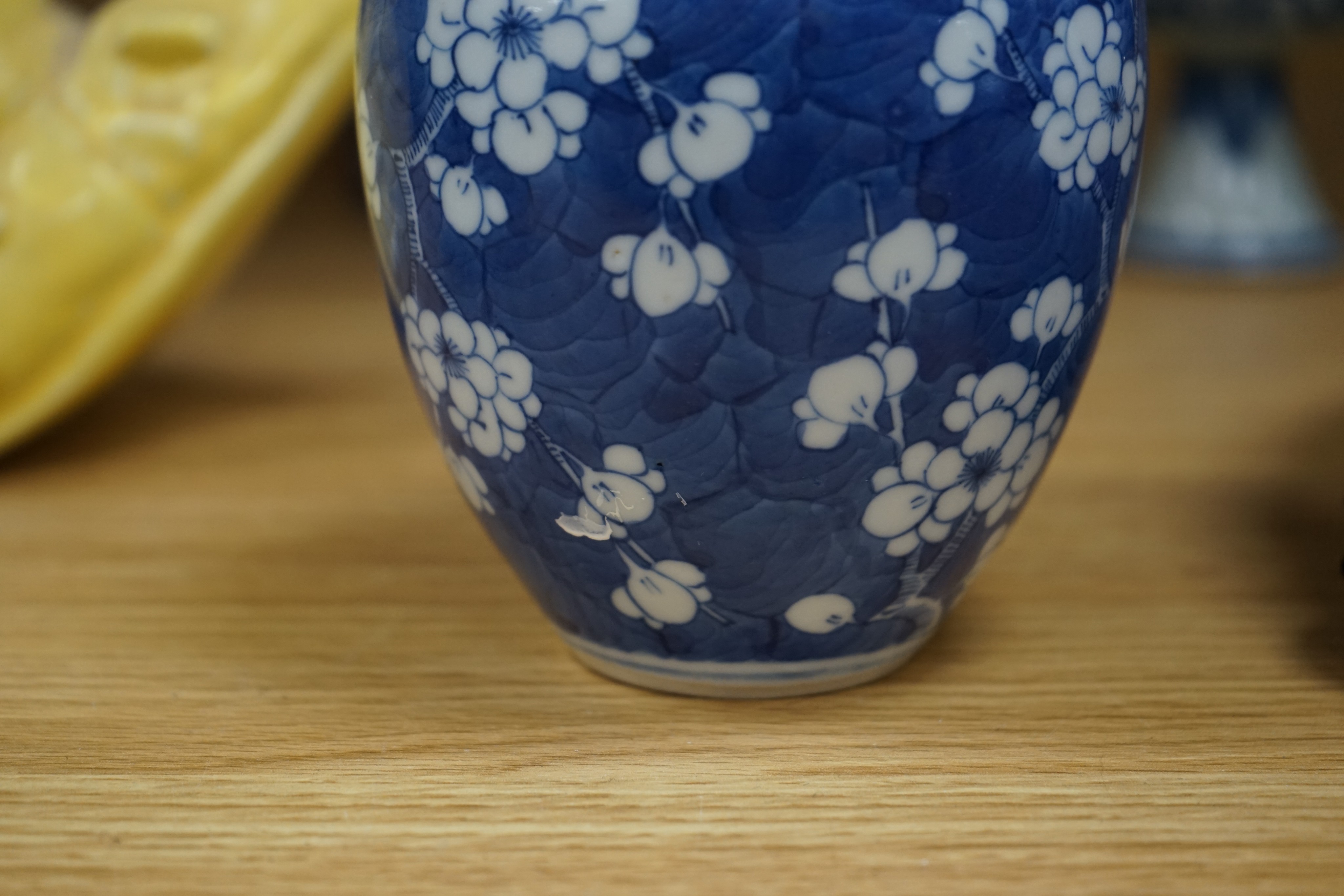 A Chinese blue and white ovoid jar and cover and similar stacking box, Kangxi and a Qing blue and white footed cup, tallest 15cm